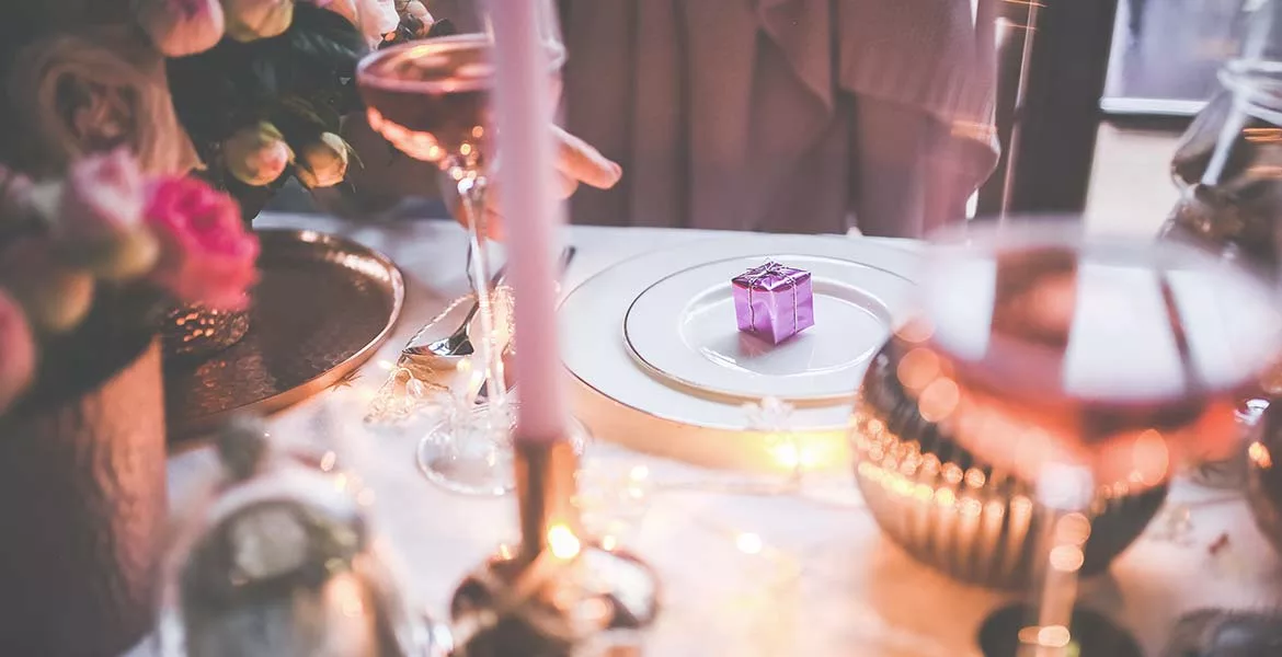 table set with a plate and candles