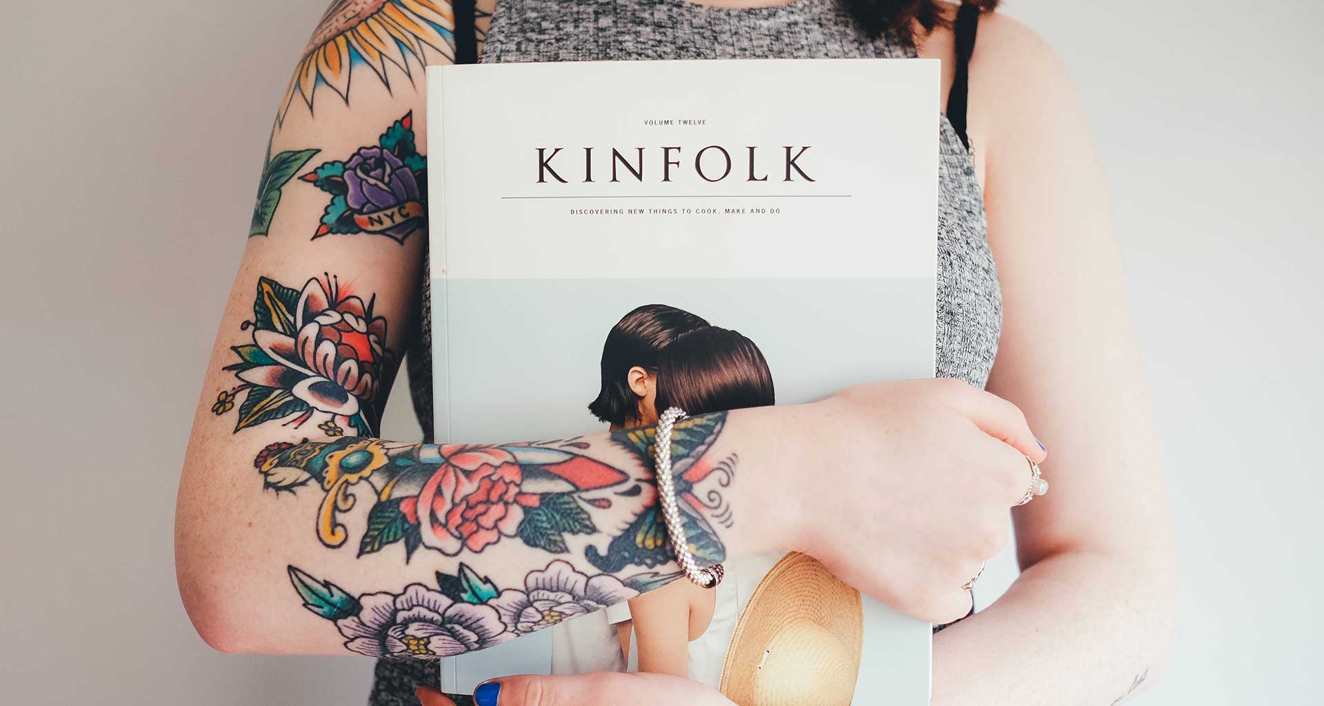 woman holding a book or a magazine