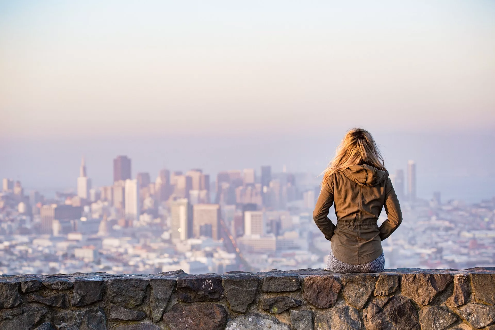 woman looking at a view of a city