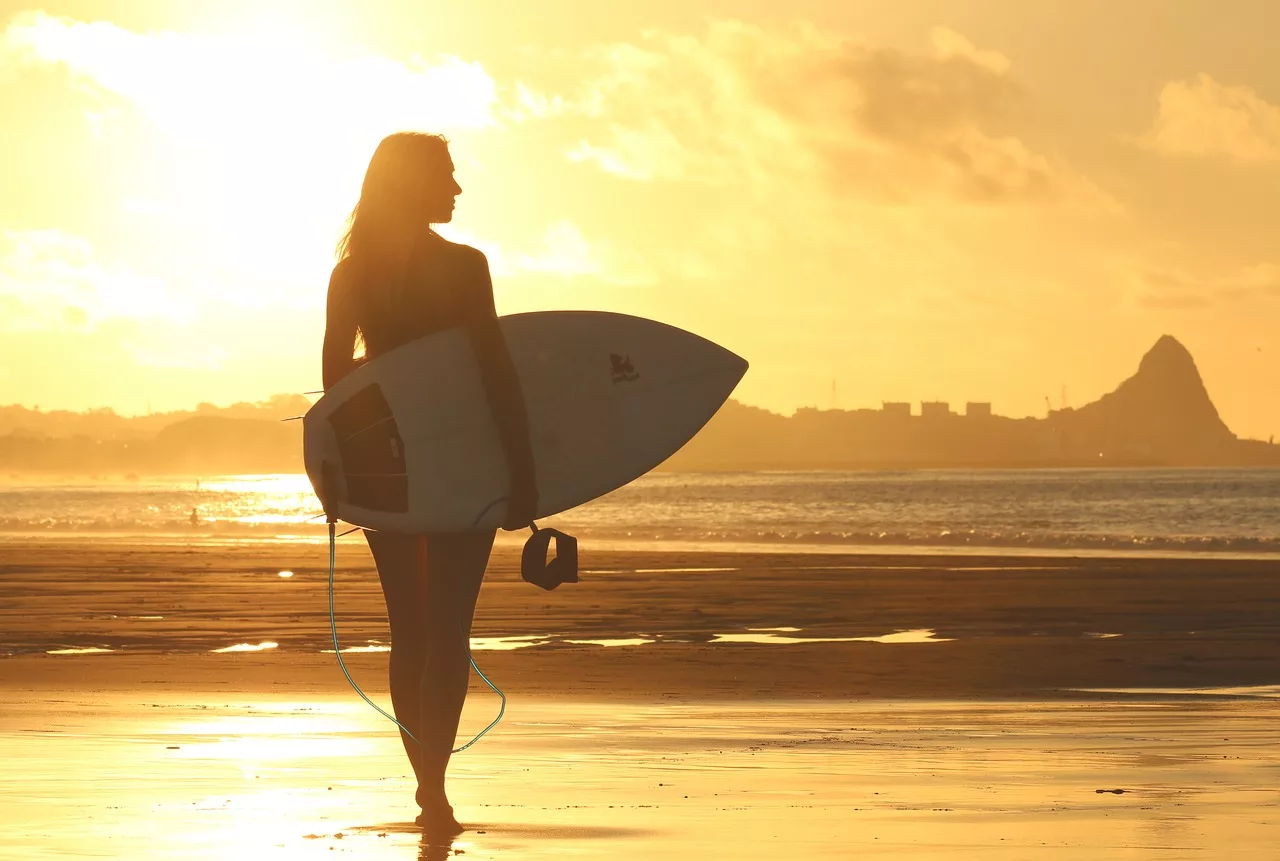 Woman getting ready to surf