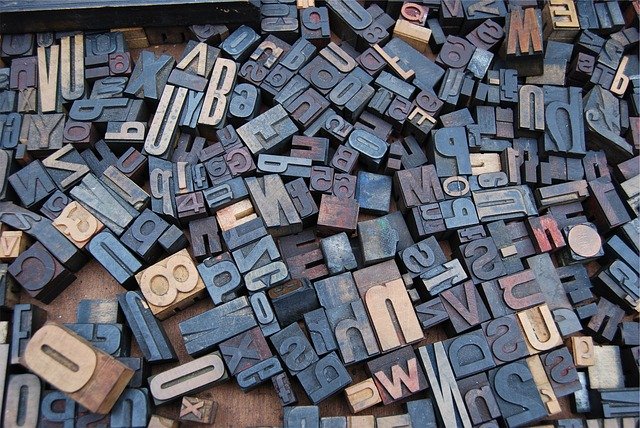 font stamps scattered on a table
