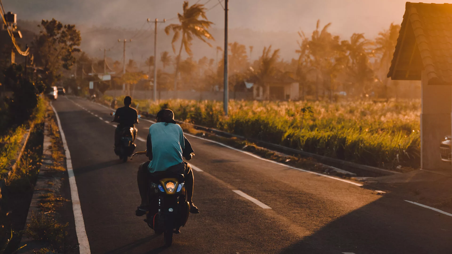 motorcycles riding on a road