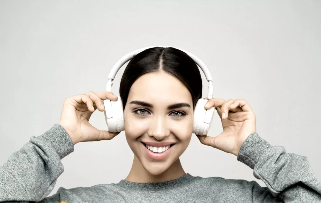 woman with headphones smiling