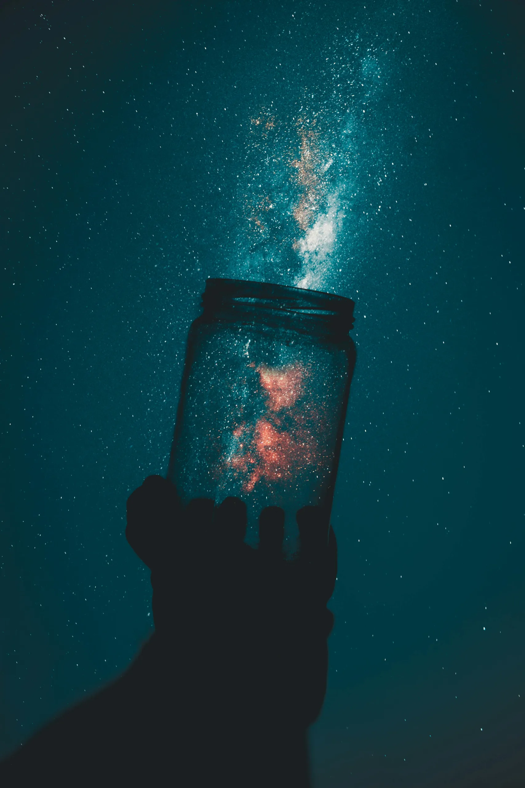 an optical illusion of someone capturing stars into a glass jar. It illustrates my goal this year to capture the dreams